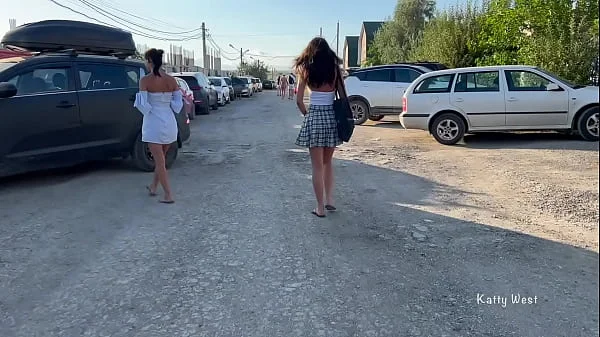 Two girls walk in public without panties and show pussies